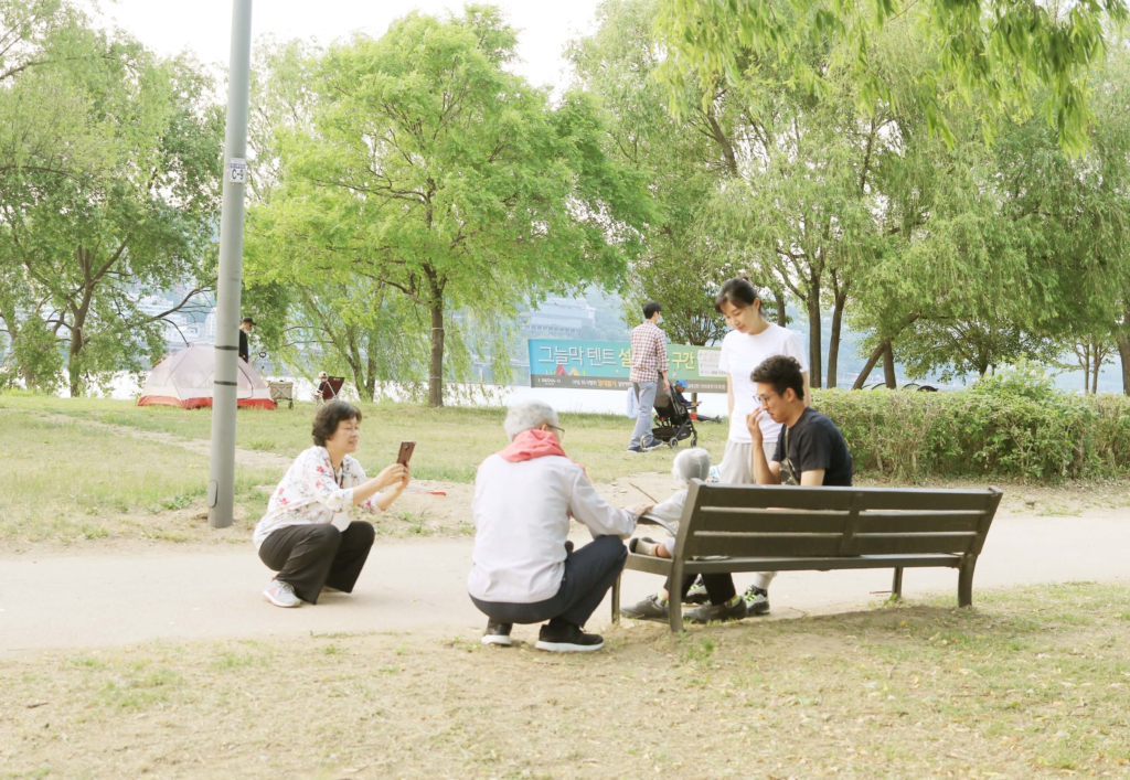 Three generations of a family enjoying a day at Hangang Park