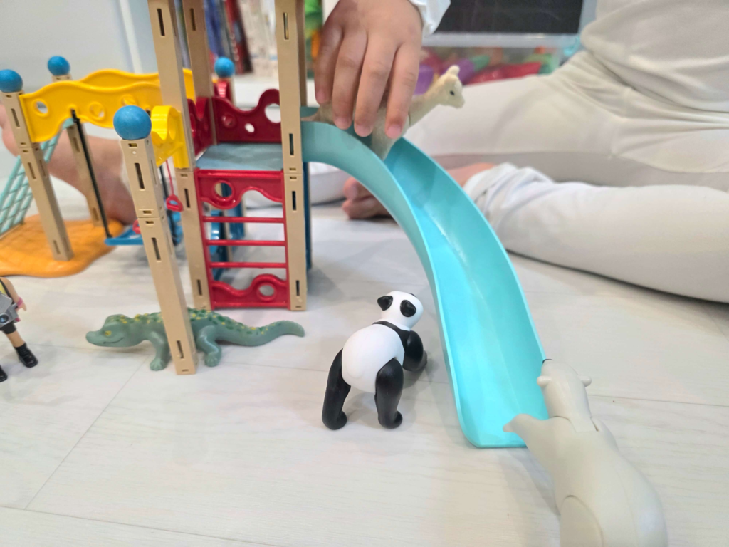 A child playing with Playmobil Happy Meal toys at home in Korea