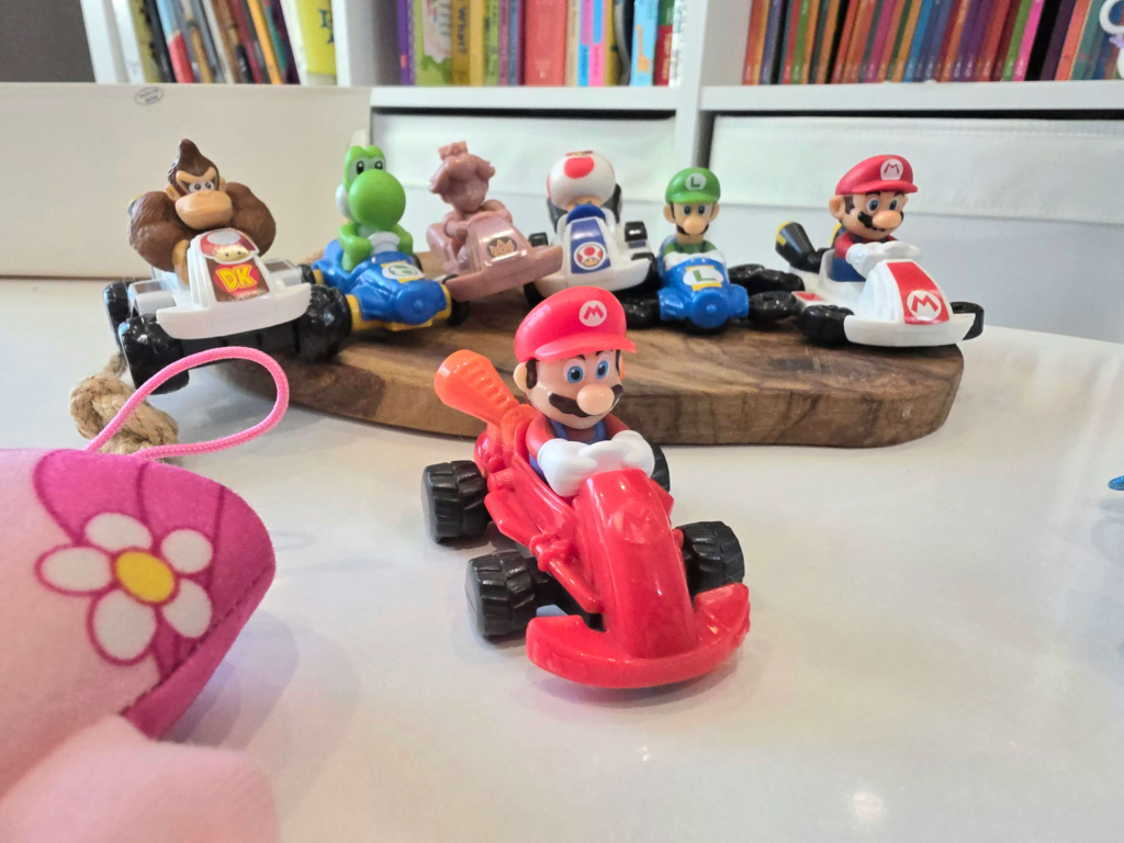 Several Playmobil Happy Meal toys displayed together at home