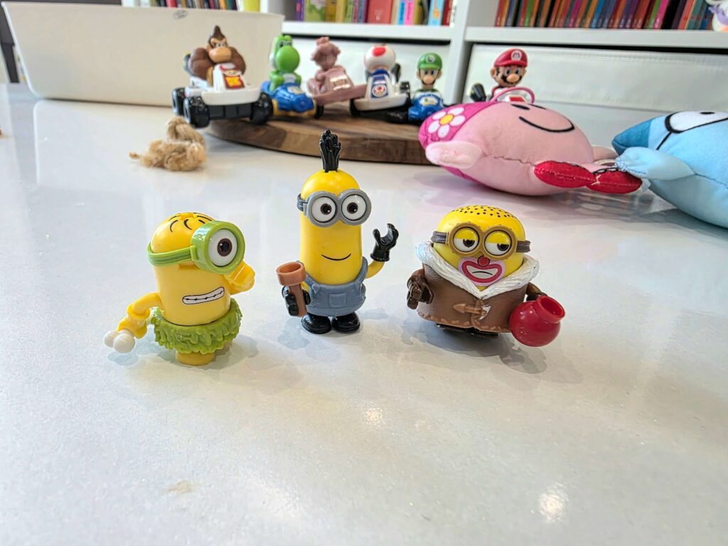 Minions Happy Meal toys displayed together at home