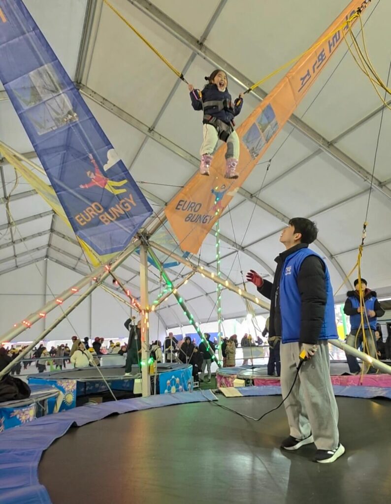 Kids having fun at a winter sledding hill in Korea