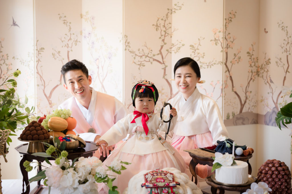 Baby choosing an item at a Doljanchi Doljabi ceremony