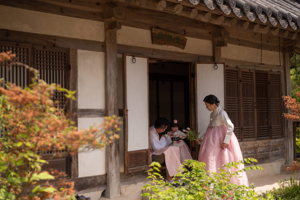 a family preparing Doljanchi celebration in Hanok