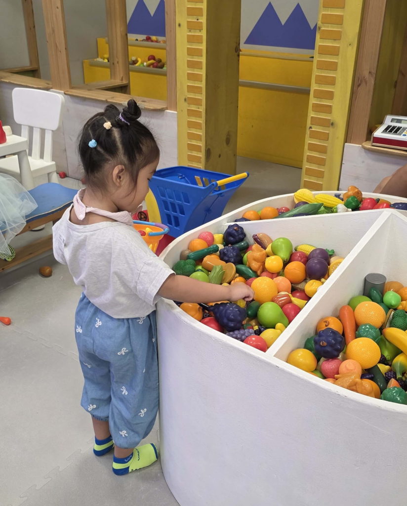 Kids playing in an indoor kids cafe playground in Korea