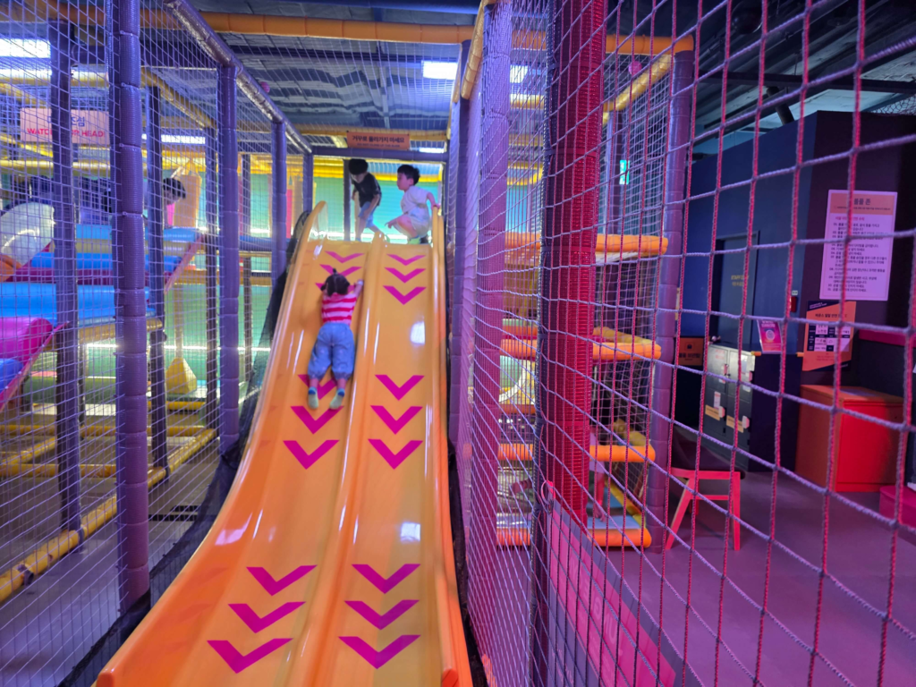 Kids playing in an indoor kids cafe playground in Korea