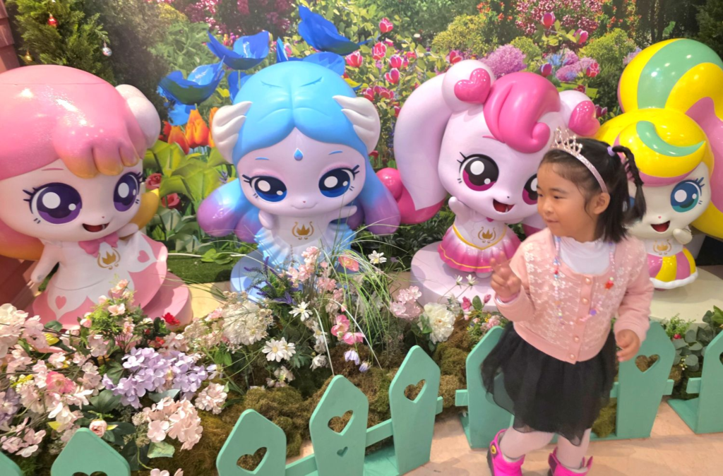 Colorful Teenieping characters with child