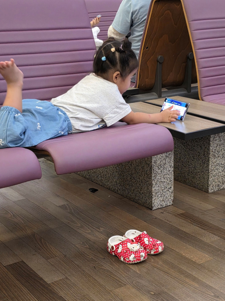 toddler watching a kids video during airport waiting time