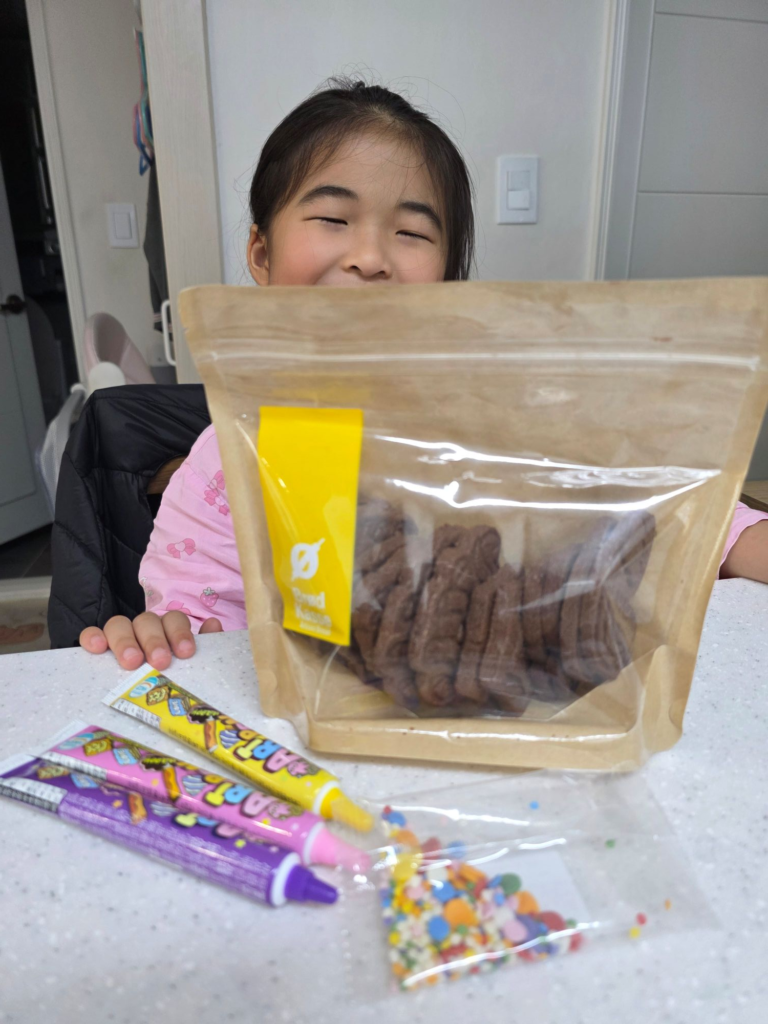 preschool child excited about cookie decorating activity