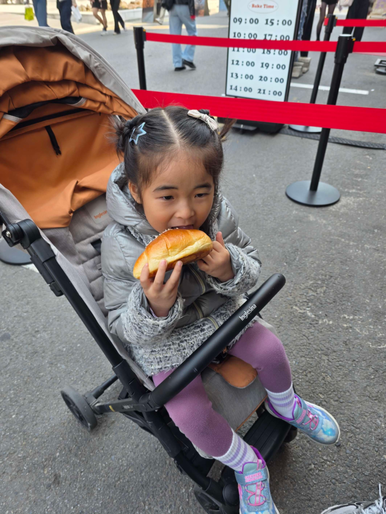 Child enjoying salt bread at a bakery in Seongsu Seoul