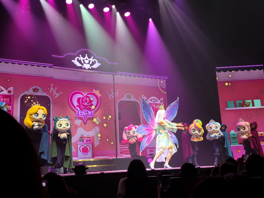 Teenieping characters greeting children after the performance