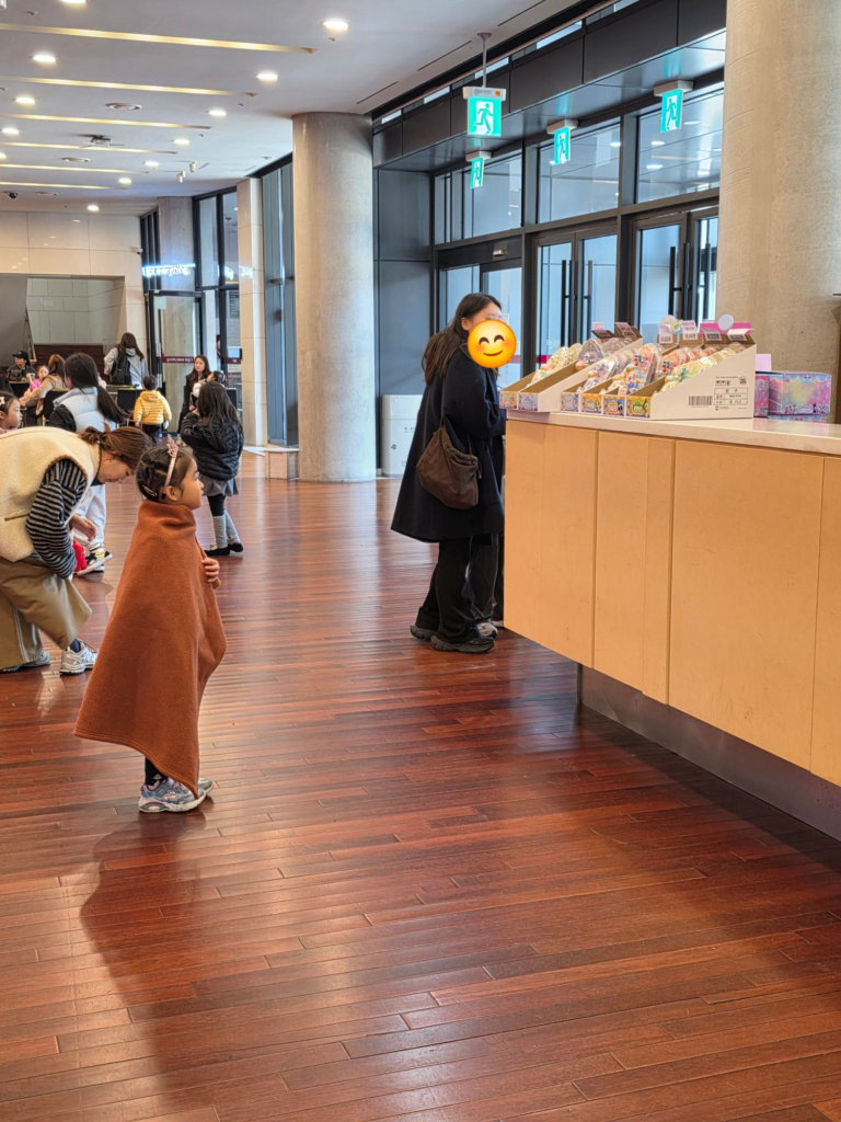 Child waiting at the ticket booth for the Teenieping Musical in Korea