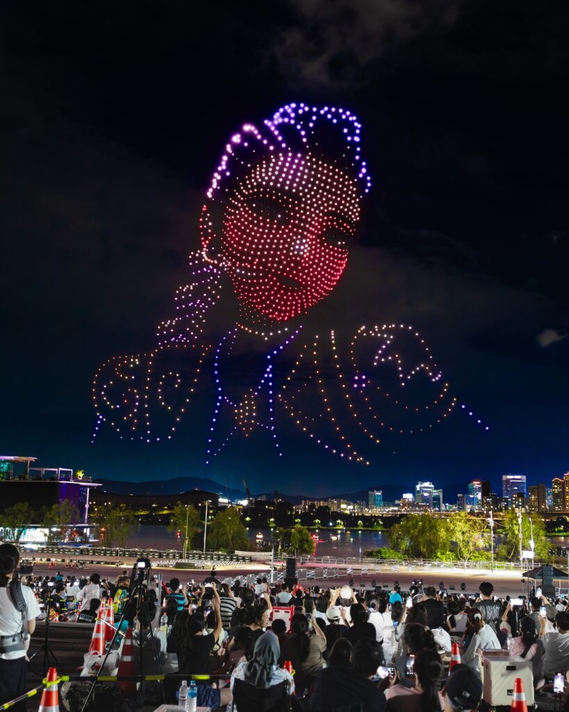 families watching k-pop demon hunters drone show at Yeouido Hangang Park Seoul