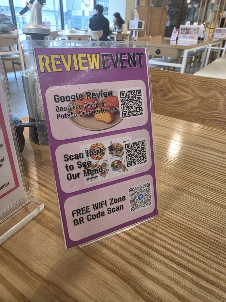 review event sign inside Korean sotbap restaurant