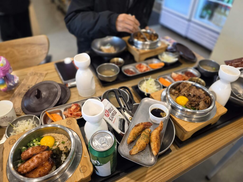 three sets of Korean pot rice sotbap on the table in Insadong