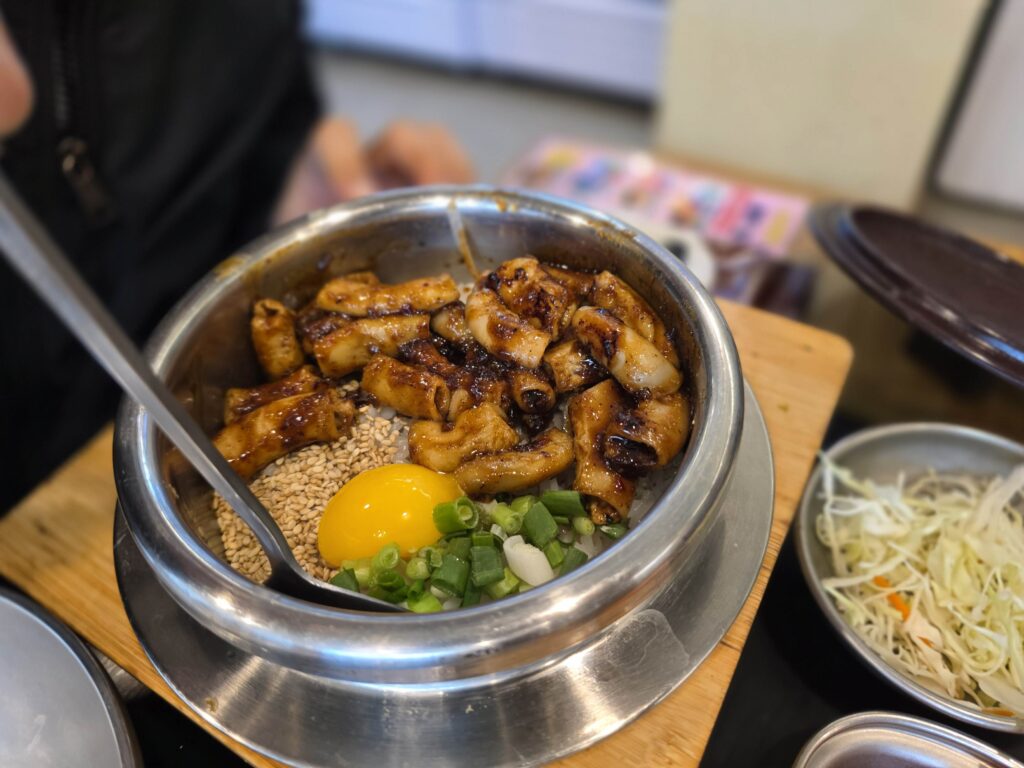 Korean pot rice with gopchang beef intestines in hot pot