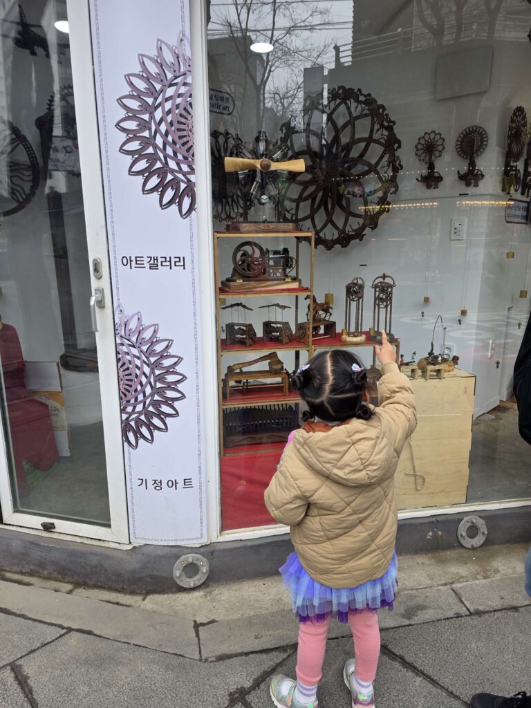 child exploring Insadong shops